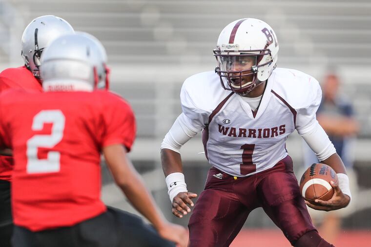 Quarterback Malik Johnson (1) and Boys' Latin will not play Olney Charter on Thursday due to forecasted hot weather,