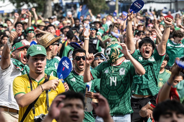 Mexican fans celebrate after Mexico scores against South Africa while watching the FIFA World Cup opening match on a giant screen during the opening day of the FIFA Fan Festival at Lemon Hill on Thursday.