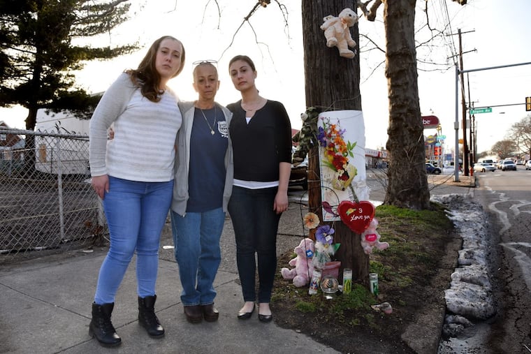 Cheryl Dimitri (center), sister of Danny Dimitri, with her daughters Stephanie (left) and Brittany Prosinski at the Cottman Avenue memorial to Danny Dimitri, who was killed in January by off-duty Officer Adam Soto.