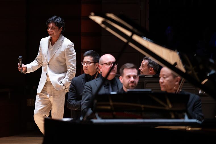 M. Night Shyamalan speaking to the audience before the Philadelphia Orchestra performed music from his films at the Kimmel Center on Friday, Sept. 20, 2024.