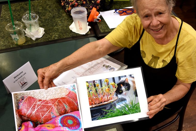 Susan Greenberg shows a photo of her cat, Bella, who died in March at age 9. She brought the image to the Death Cafe at the Center City Barnes & Noble.