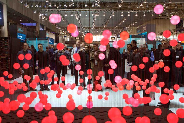 Illuminated plastic balls represent cloud computing at the IBM stand at a past CeBIT gathering in Hanover, Germany. This concept draws on databases, operating systems, memory, microprocessors, and the Internet, and the package can be a powerful tool.