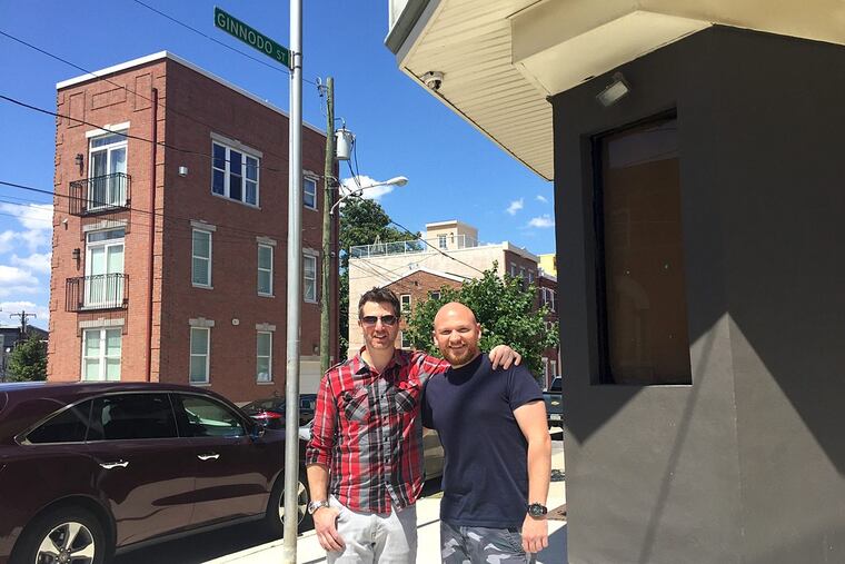 Brothers Kris (left) and Tom Kwiatkowski outside of Gin & Pop.