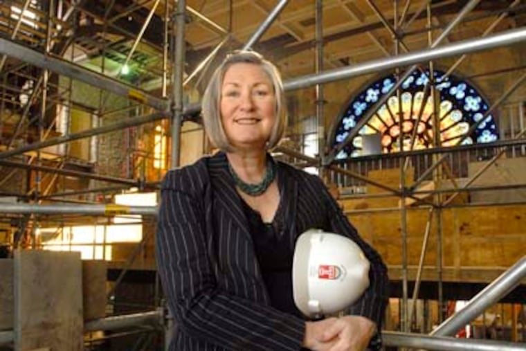 At Temple University, president Ann Weaver Hart in the Baptist Temple where some of the anonymous donation is going for renovation. (April Saul / Inquirer)