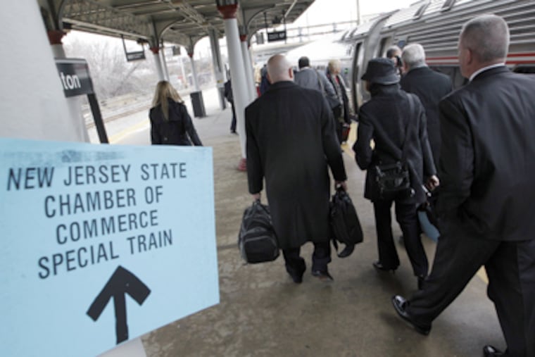 In Trenton, travelers board for the Chamber of Commerce's annual trip to Washington and congressional dinner. (Mel Evans / Associated Press)