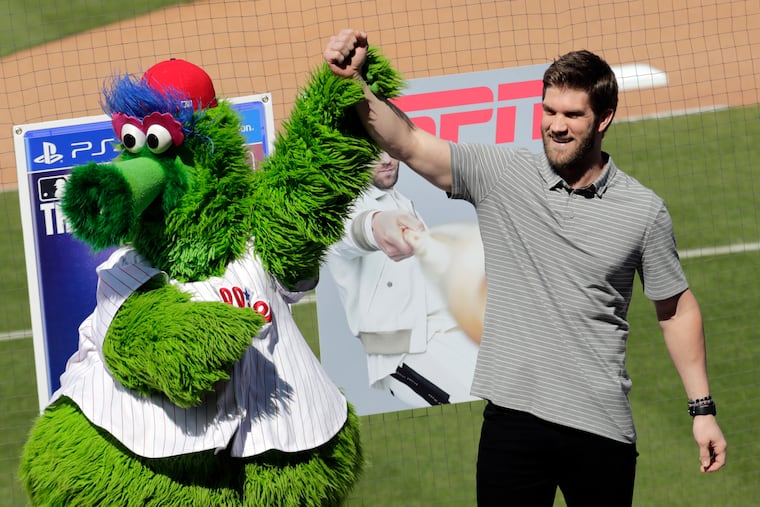 This time a year ago Bryce Harper (right) had launched 12 homers as the Phillies' newest star. Now, he's waiting to return to a COVID-shortened season as owners whittle away at his compensation and fans endure another labor delay. None of it will matter.