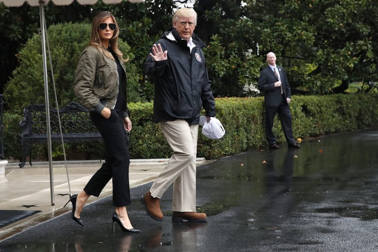 President Trump, accompanied by first lady Melania Trump, waves as they walk from the White House Tuesday on their way to Texas to view the federal government's response to Harvey's devastating flooding.