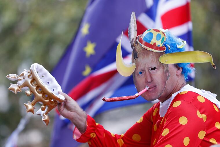 An anti Brexit demonstrator wears a mask depicting Britain's prime minister Boris Johnson protests outside the Cabinet office in London, Thursday, Aug. 29, 2019. Political opposition to Prime Minister Boris Johnson's move to suspend Parliament is crystalizing.