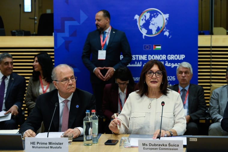 European Commissioner for the Mediterranean Dubravka Suica, right, and Palestinian Prime Minister Mohammad Mustafa participate in a round table meeting of the Palestinian Donor Group at EU headquarters in Brussels, Monday, July 13, 2026.