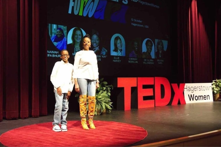 Hyuston and Chekesha Ellis on the TEDx stage in Hagerstown, Md., in 2023.
