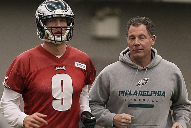 Eagles quarterback Nick Foles and offensive coordinator Pat Shurmur. (David Maialetti/Staff Photographer)