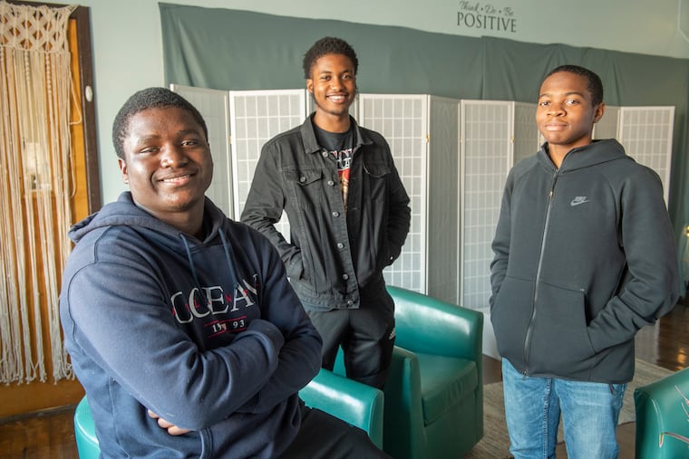 Students at the Parkway Center City Middle College High School are holding an anti-violence event. From left are Frank Gillis-Corbitt , Jaden Burnett, and Quadir Gamble. (Jonathan Wilson / For the Inquirer)