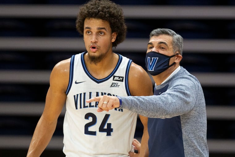 Villanova head coach Jay Wright talks with forward Jeremiah Robinson-Earl (24) during the first half of the Wildcats' game against Seton Hall on Jan. 19. Robinson-Earl said that his team's love for basketball helped it get through the challenges of the pandemic.