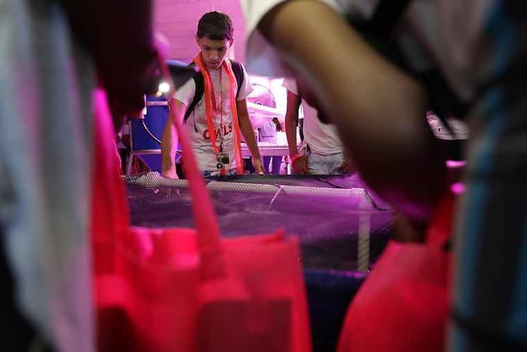 Carlos Torres and other high school students from the College Bound Academy program check out the hydroponics lab in a visit to Temple University's Ambler Campus.