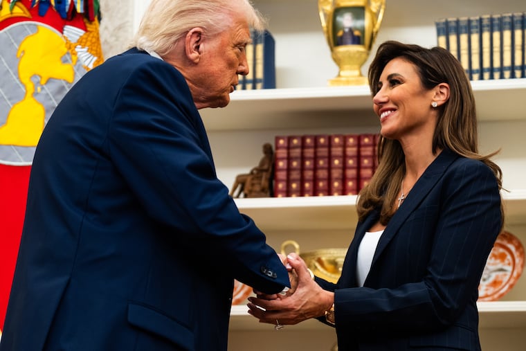 President Donald Trump with Alina Habba, in March.