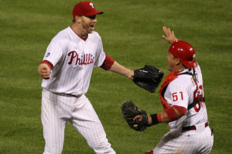 Roy Halladay and Carlos Ruiz were the first to celebrate the completion of Halladay's no-hitter. (David M Warren/Staff Photographer)