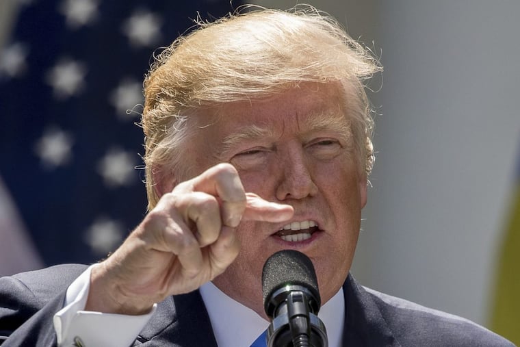 President Trump speaks during a news conference with Romanian President Klaus Werner Iohannis in the Rose Garden at the White House on Friday.