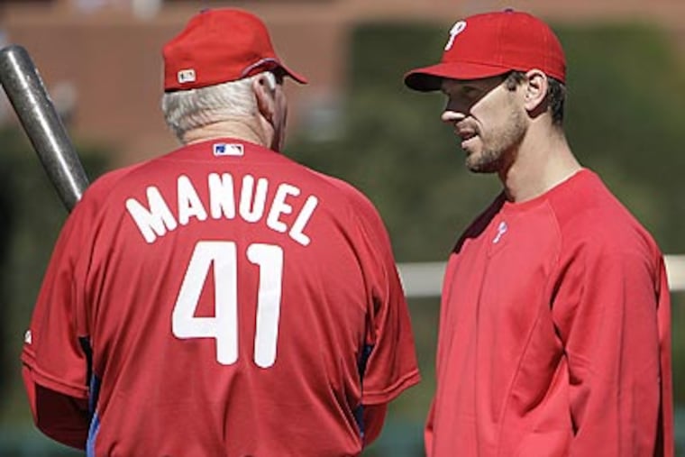 Cliff Lee (right) will be the Phillies' starting pitcher in Game 1 of the National League Division Series against the Colorado Rockies this afternoon. (David Maialetti/Staff Photographer)