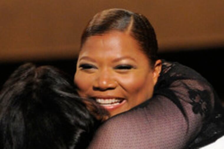 Queen Latifah hugs Nikki Blonsky at Monday's Critic's Choice Awards. Tuesday, Latifah hosted a quiet People's Choice.