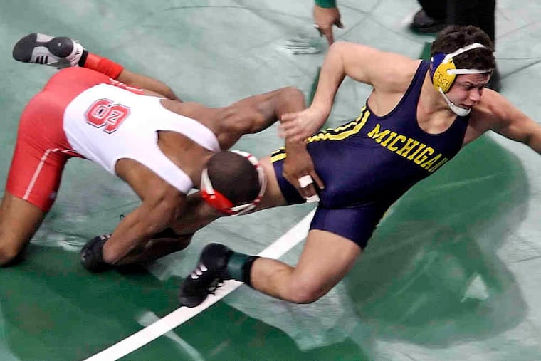Darrion Caldwell was hurt on this move during second-round bout against Michigan's Eric Grajales.
