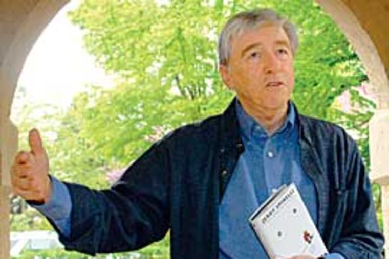 Jerry Spinelli holds forth at his home in Wayne. Though he lives on the Main Line now, it was Norristown that made him, and Norristown memories that keep him - and his books - going. (PETER TOBIA / Inquirer)