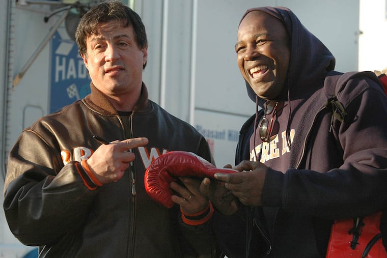 Matthew Saad Muhammad (right) meeting with actor Sylvester Stallone during filming of a “Rocky” movie in 2006. (File Photo)