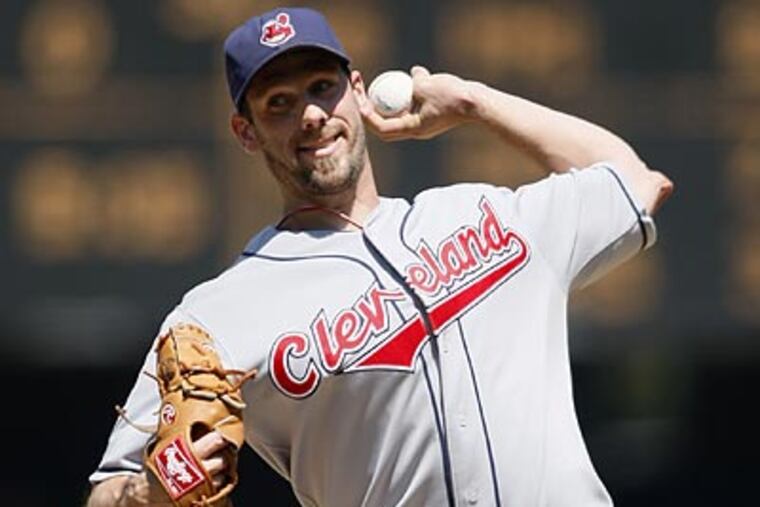Baseball sources believe that a package of second-tier prospects like pitcher Carlos Carrasco and infielder Jason Donald might be sufficient to pry pitcher Cliff Lee from Cleveland. (John Froschauer / AP)