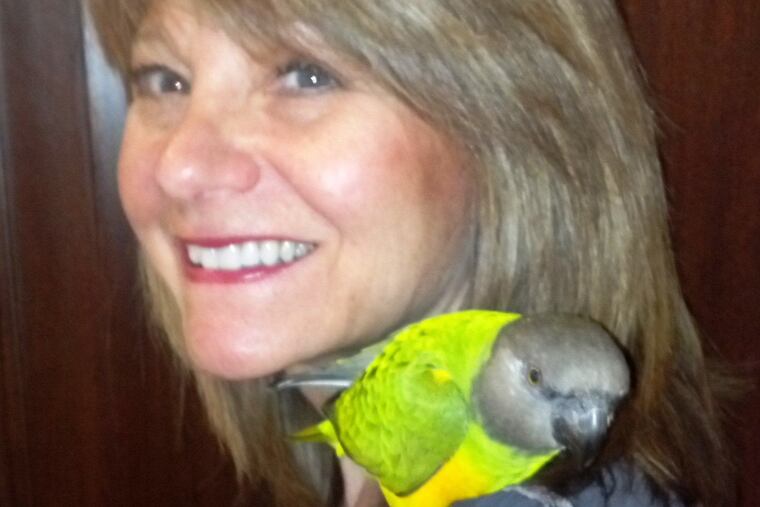 Anne Loeser and her bird Pumpkin.