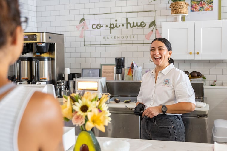 Cote Tapia-Marmugi, owner of Copihue Bakehouse, chats with a customer.