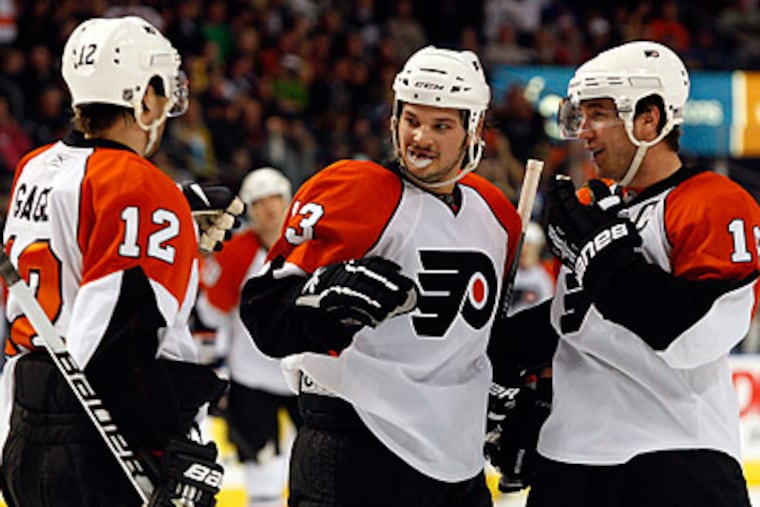 The Flyers are currently sixth in the Eastern Conference and will face Olympic hero Ryan Miller tonight. (Mike Carlson/AP)