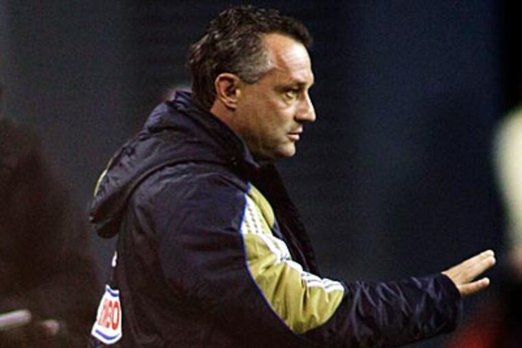 Peter Nowak and the Union hold the 13th, 32nd and 35th picks in the MLS SuperDraft. (Ted S. Warren/AP file photo)