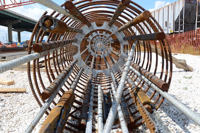 A massive steel rebar cage that will be dropped into the ground down to bedrock, beneath the I-495 bridge in Delaware. The rebar cage is one of 32 that will reinforce new underground concrete piles, or supports, for the repaired bridge. (VIVIANA PERNOT/ Staff Photographer)