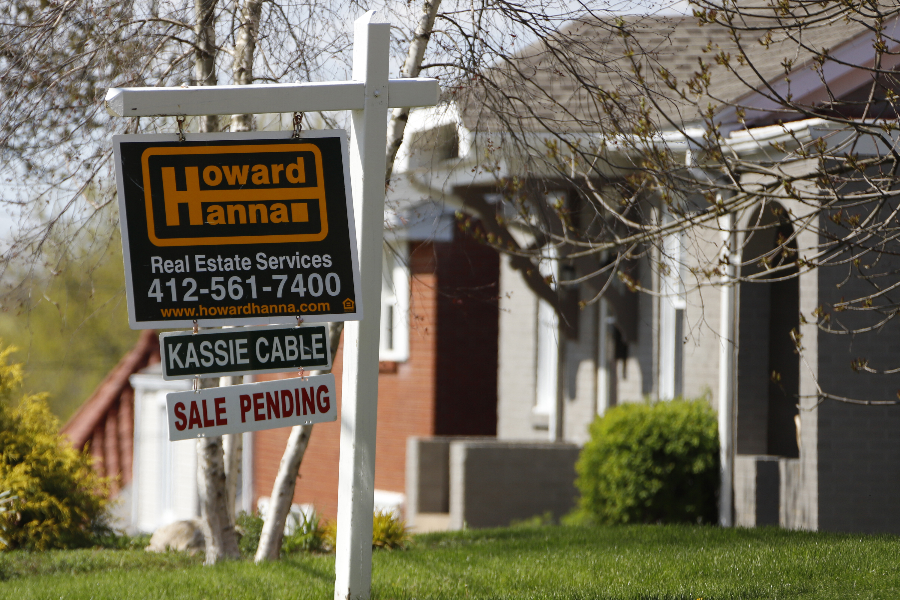 This file photo shows a sale-pending sign on a home in Mount Lebanon, Pa.