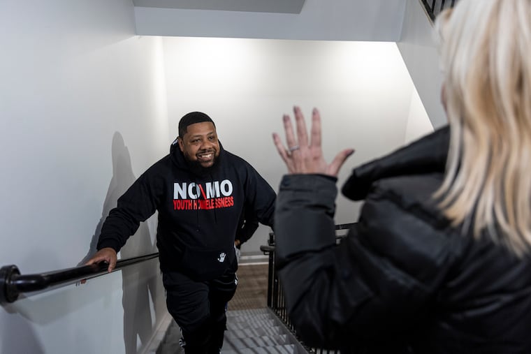 Rickey Duncan surprised a group of young women with apartments in a December 2022 file photograph. Last year, NOMO gave up the leases for the apartments citing a lack of funding.