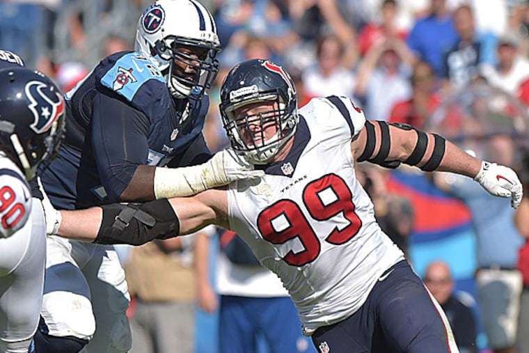 Titans tackle Michael Oher blocks Texans defensive end J.J. Watt. (Don McPeak/USA Today Sports)