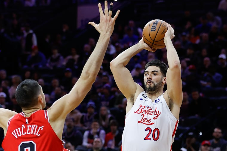 Sixers forward Georges Niang shoots the basketball againstChicago Bulls center Nikola Vucevic on Monday, March 20, 2023 in Philadelphia.