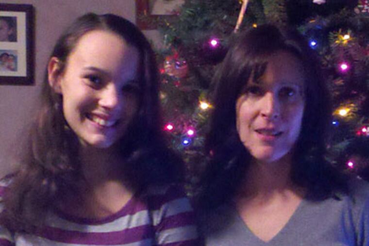 Scott Hawley's wife, Melissa, with their daughter, Casey (left).