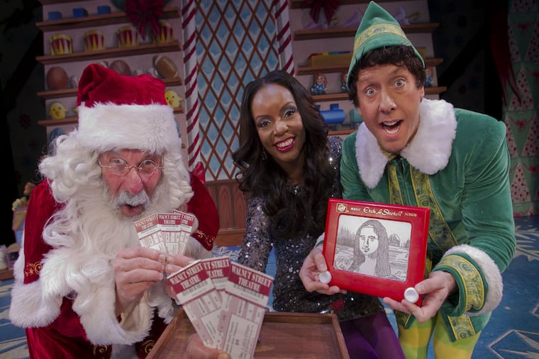 Santa Claus portrayed by Bill Van Horn and Buddy, by Christopher
Hutton in Elf at the Walnut Street Theater with Jenice Armstrong of the Philadelphia Daily News. Jenice will be giving away tickets to production of 'Elf' for Christmas.