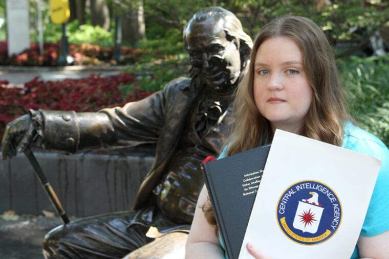 Bridget Nolan, 33, of Jenkintown, a sociologist by education, decided to turn her work as a counter terrorism analyst for the CIA into her doctoral thesis - much to the agency's chagrin. Nolan's thesis, which looked at how the nation's 16 intelligence agencies communicate and share information was delayed by almost two years because the CIA declined to approve the work, citing concerns about classified information. It wasn't until she resigned from the agency and got a lawyer that the CIA gave the green light for the dissertation to be published. She defended her thesis at the University of Pennsylvania on April 15 - coincidentally at the exact time of the Boston Marathon bombings. She is shown by a Benjamin Franklin statue along the Locust Walk on the Penn campus. (CHARLES FOX / Staff Photographer)