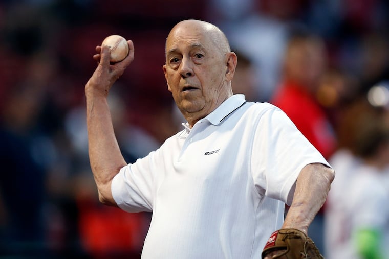 ESPN co-founder Bill Rasmussen tosses a ball before a baseball game between the Boston Red Sox and the New York Yankees in Boston, Sept. 8, 2019.