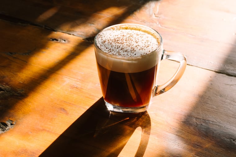 New Liberty Distillery's Layover drink mixes two types whiskey with banana-infused whipped cream and nutmeg.