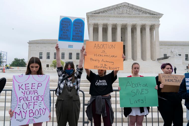 Demonstrators protest outside of the U.S. Supreme Court Tuesday, May 3, 2022 in Washington. A draft opinion suggests the U.S. Supreme Court could be poised to overturn the landmark 1973 Roe v. Wade case that legalized abortion nationwide, according to a Politico report released Monday. Whatever the outcome, the Politico report represents an extremely rare breach of the court's secretive deliberation process, and on a case of surpassing importance. (AP Photo/Jose Luis Magana)