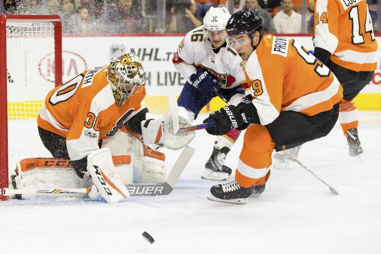 Flyers defenseman Ivan Provorov, right, pursues a loose puck Tuesday.