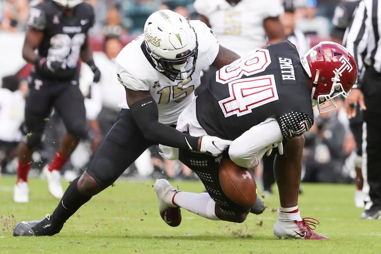 Temple wide receiver Jordan Smith (84) makes the catch, but then fumbles the ball after pressure from UCF linebacker Tatum Bethune (15) in the second quarter of a game at Lincoln Financial Field Saturday, Oct. 30, 2021. Temple lost, 49-7.