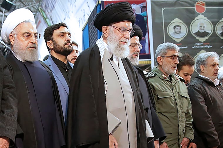Supreme leader Ayatollah Ali Khamenei (center) leads a prayer over the coffins of Gen. Qassem Soleimani and his comrades, who were killed in Iraq in a U.S. drone strike on Friday.