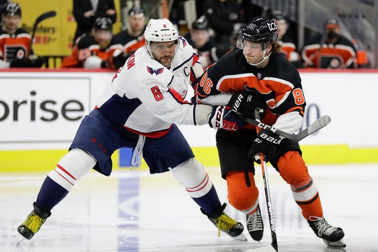 Flyers left winger Joel Farabee battled for position against Washington Capitals left winger Alex Ovechkin (8) in a March 11 game. Ovechkin leads the Caps with 21 goals, while Farabee tops the Flyers with 15.