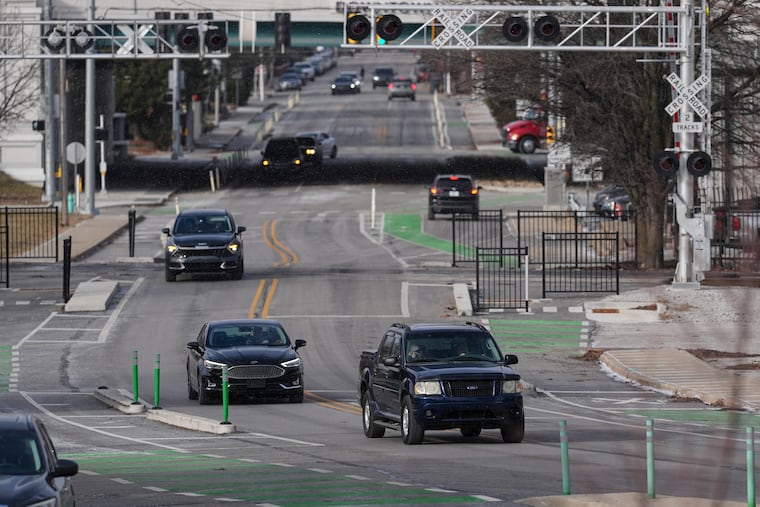 Cars make their way onto the recently converted two-way portion of Michigan Street in Indianapolis, Thursday, Jan. 15, 2026.