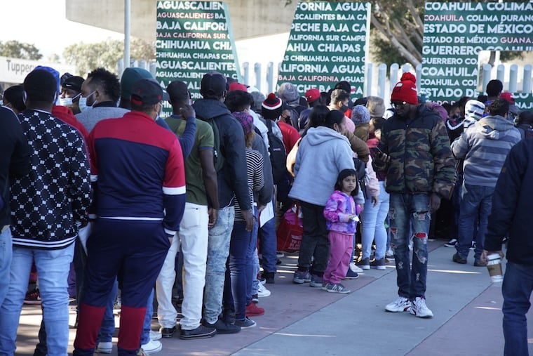 Hundreds of asylum-seekers gather at Chaparral Border Crossing on Friday, Feb. 19, 2021, in Tijuana, Baja California.