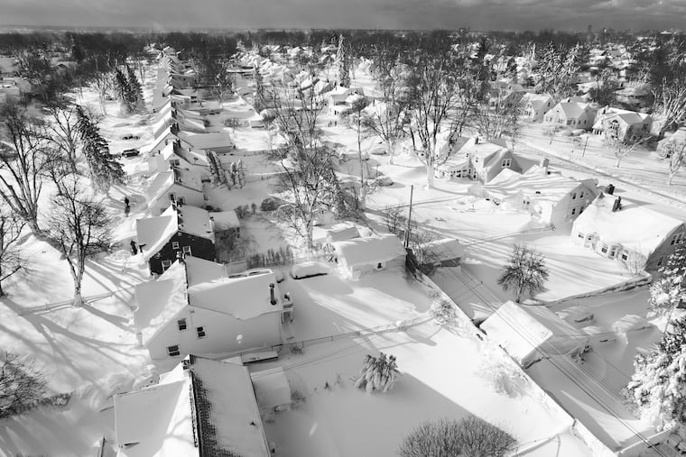 In this drone image, snow blankets a neighborhood, Sunday, Dec. 25, 2022, in Cheektowaga, N.Y. Millions of people hunkered down against a deep freeze Sunday morning to ride out the frigid storm that has killed at least 24 people across the United States.