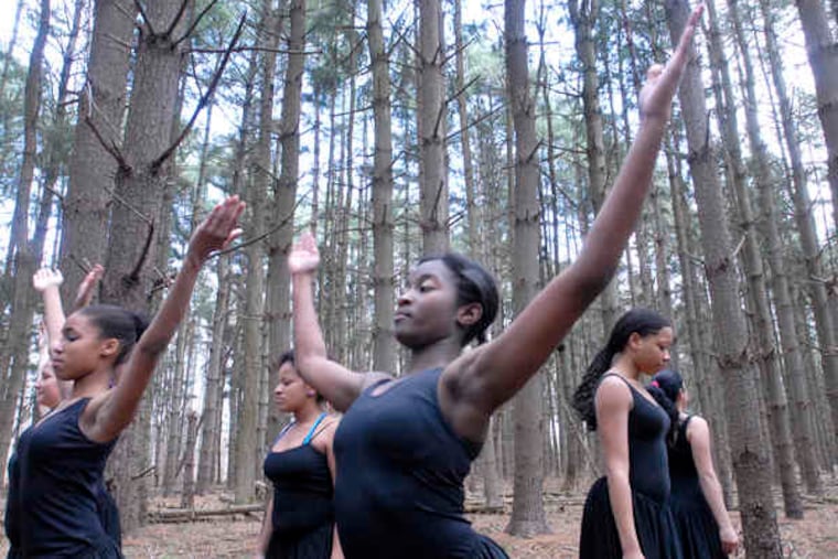 Dancing in the woods, Richelle Rand (center) and her classmates from Creative Arts High in Camden visited Rancocas Nature Center this week to learn about th environment.